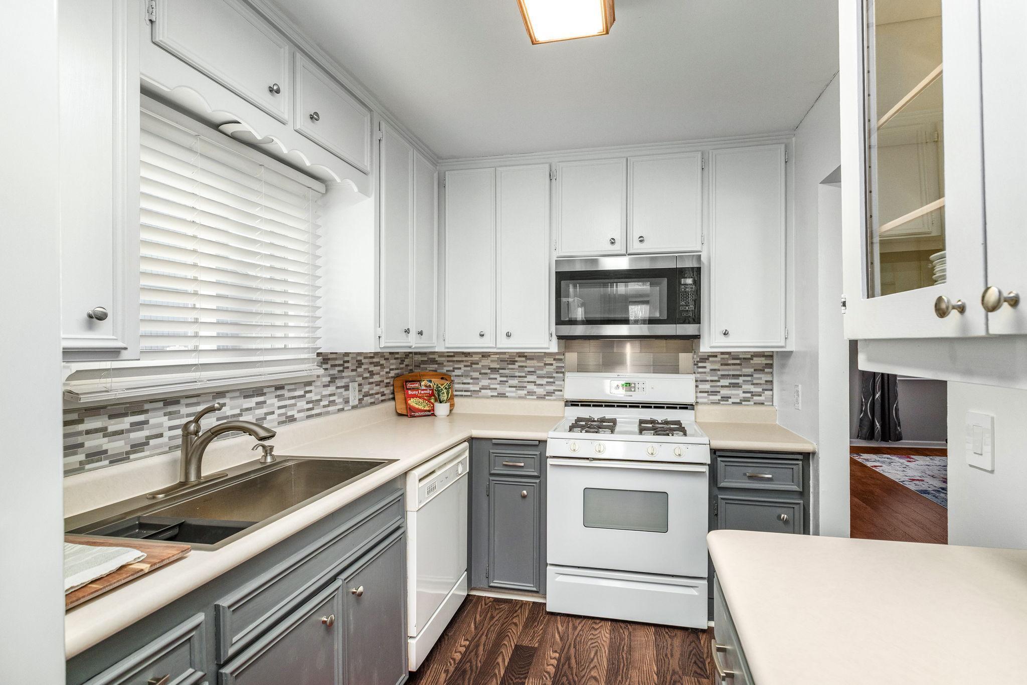 brand new sink, lots of counter space! And a kitchen window - something many townhomes don't have.