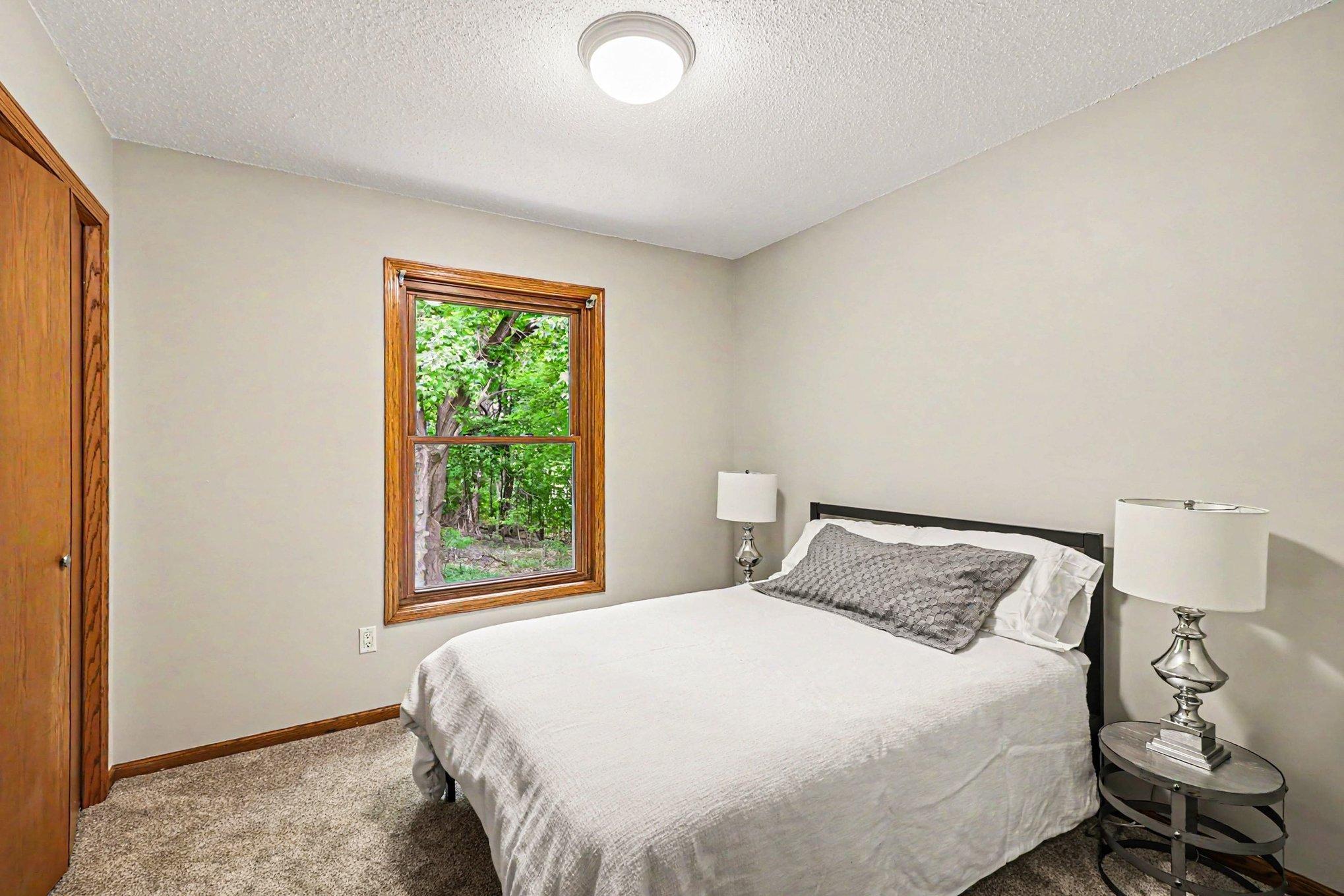 the second bedroom overlooks the private backyard