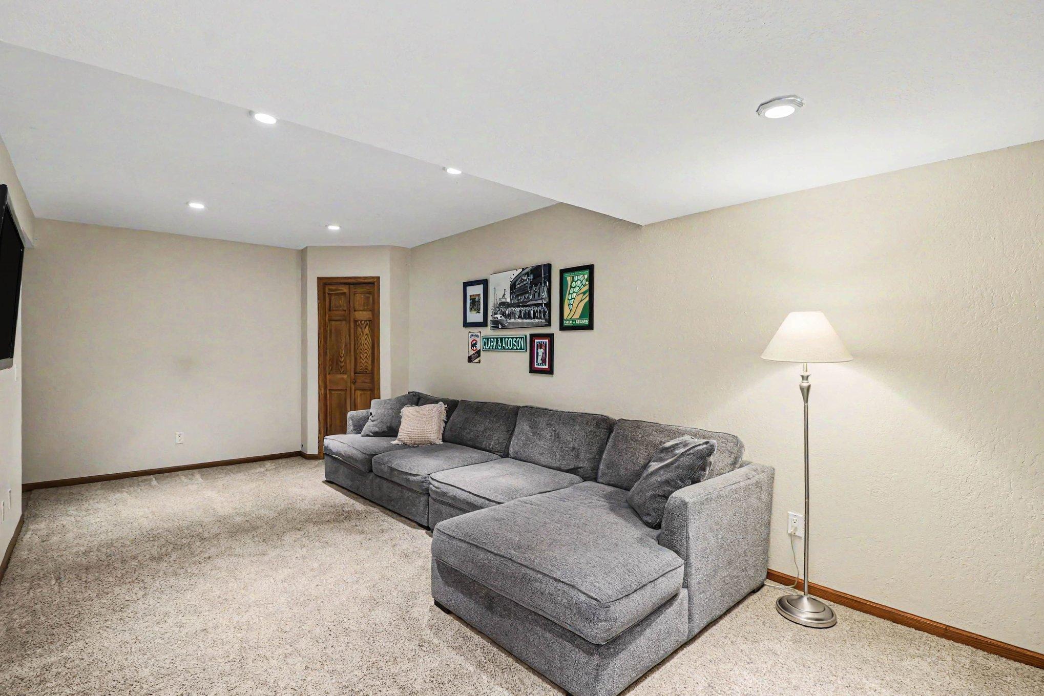 A basement big enough for a large sectional with room to spare, perfect for a hang-out. There is also lots of storage down here in the crawlspace that's super clean, large, and insulated.