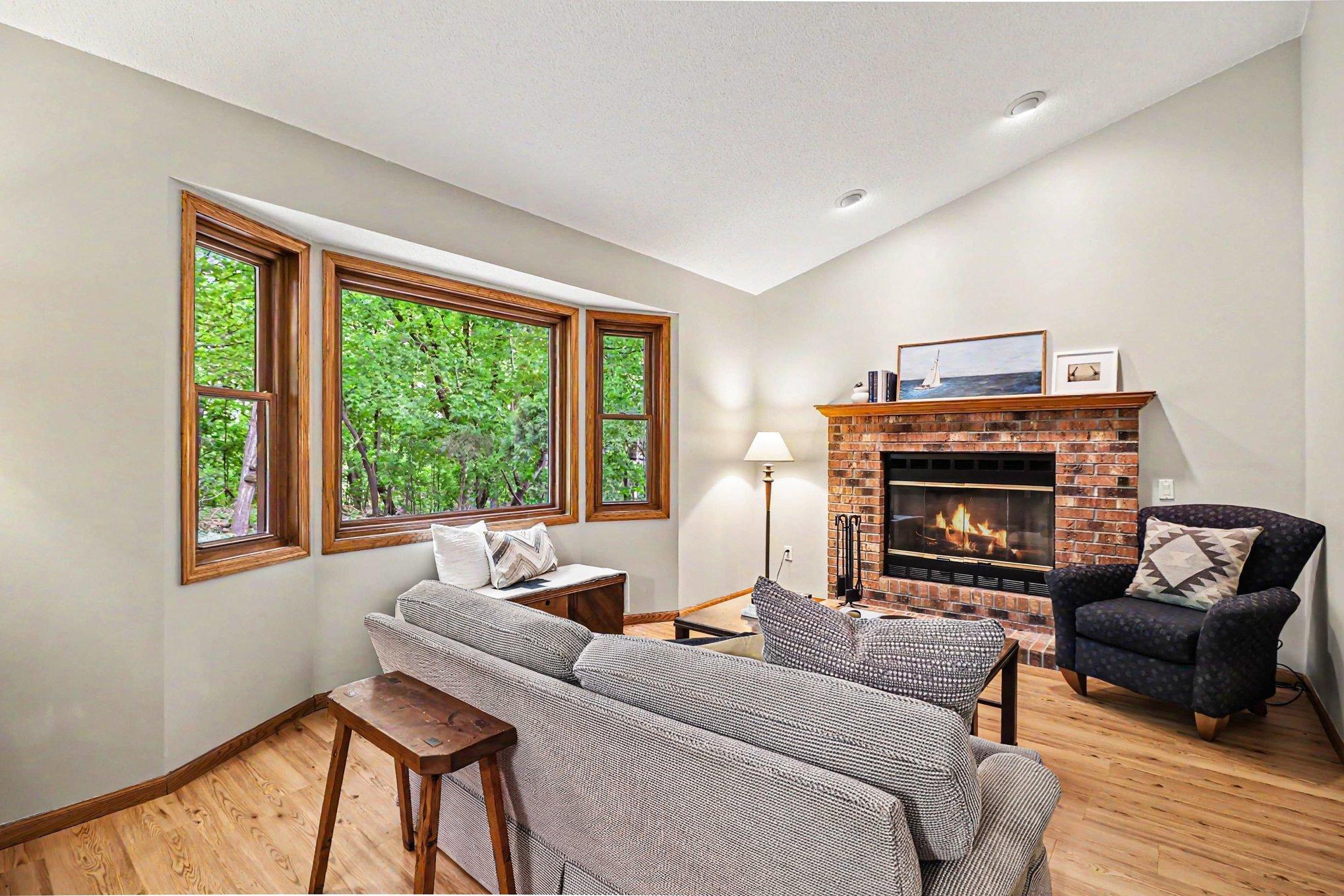 Vaulted main floor family room right off the kitchen with a cozy wood burning fireplace