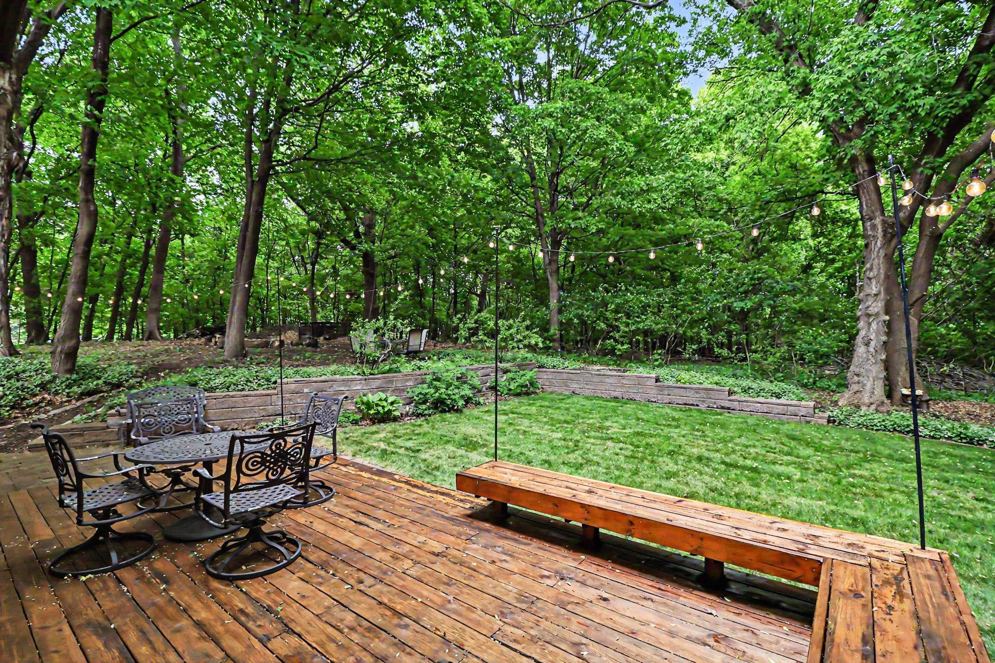 Property backs up to acres of DNR land, keeping things wild and private. A second patio and firepit complete this private nature retreat