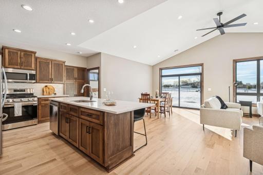 A bright, sunny dining space with an 8 foot slider that walks out to a concrete patio.