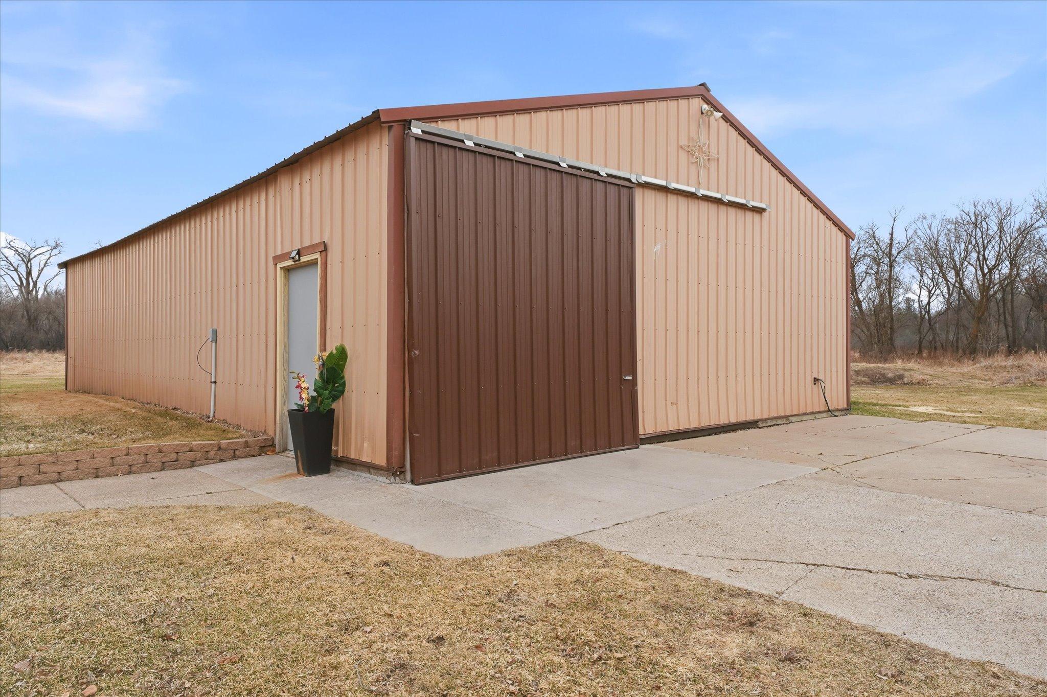 Impressive 32x48 pole building with concrete floor, power (200 amp) and drive-through. Ideal for equipment, storage, or projects.