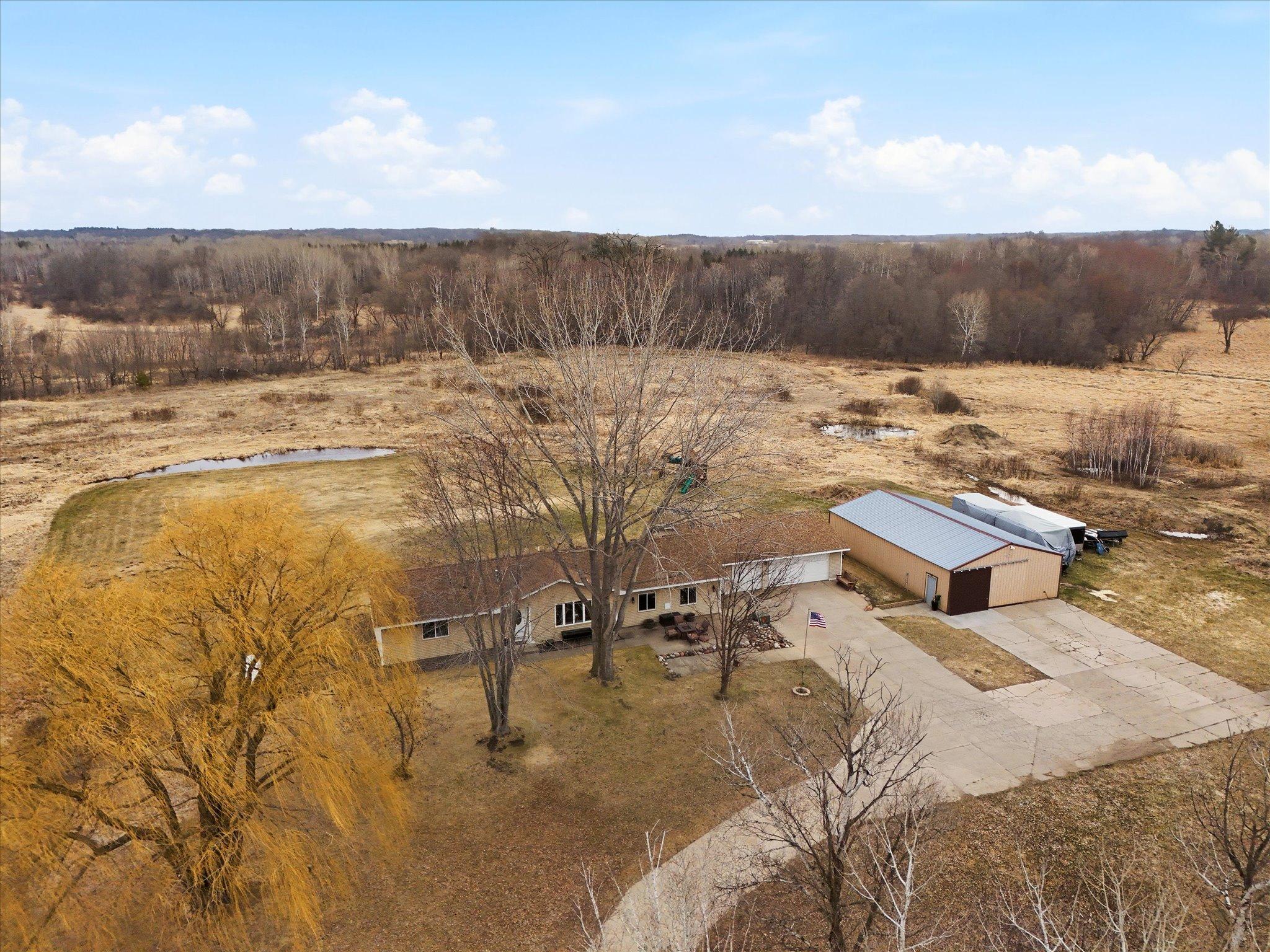 27 acres, One Level Home, 3 Car Garage plus Pole Building