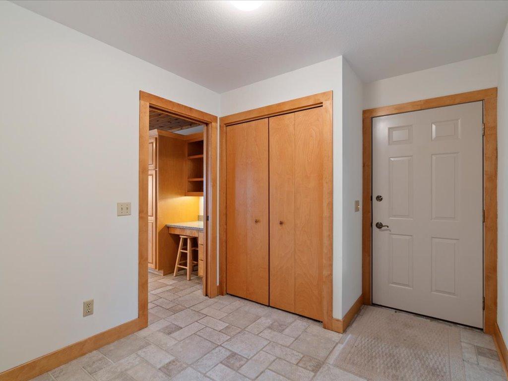 A practical mudroom entry from the attached garage provides convenient storage and a seamless transition into the heart of the home.