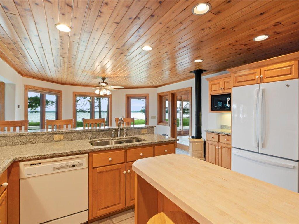 Prepare meals while enjoying views of Upper Whitefish Lake, with generous workspace and gathering areas designed for effortless entertaining.