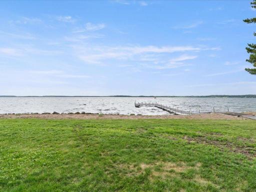 Level elevation leads to 300 feet of pristine Upper Whitefish Lake shoreline, offering effortless access to the water and expansive sunset views.