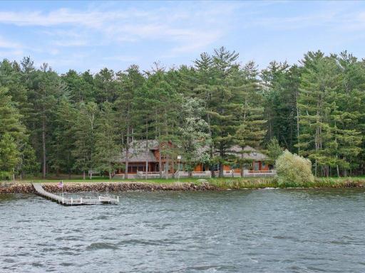 Set among towering pines on 300 feet of Upper Whitefish Lake shoreline, this private estate offers a rare combination of seclusion, space, and spectacular waterfront living.