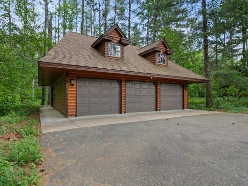 A detached three-stall garage with dedicated workshop space provides exceptional storage, workspace, and flexibility for lake-life essentials.