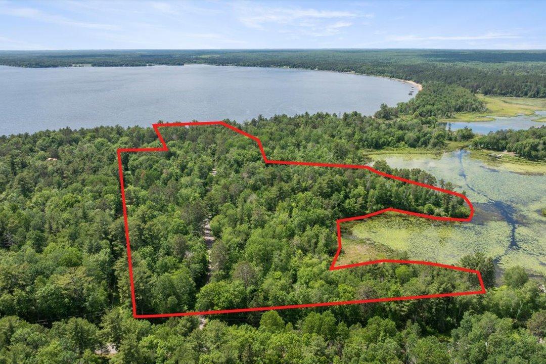 Property boundaries outlined to showcase the full 21.4-acre estate spanning two parcels, with 300 feet of Upper Whitefish Lake frontage and additional access through Mud Lake to the Whitefish Chain.