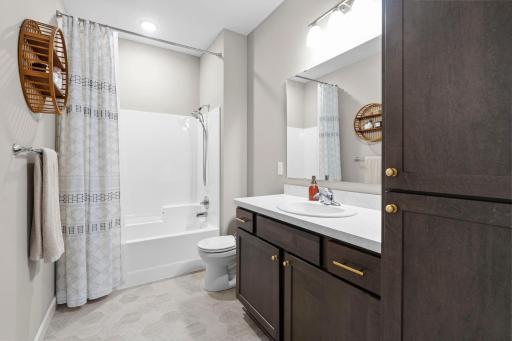 The main level bathroom has soft close doors and drawers as well along with maintenance free LVT flooring.