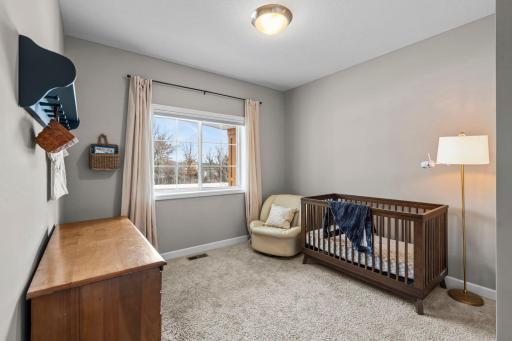 The second bedroom on the main level features room darkening shades to keep the room cool during the summer months.