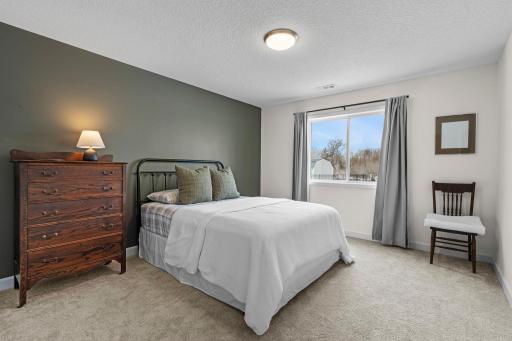 The 3rd bedroom is in the lower level and looks out to the backyard.