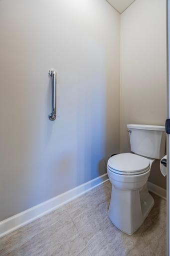 Heightened toilet with accessible grab bar!