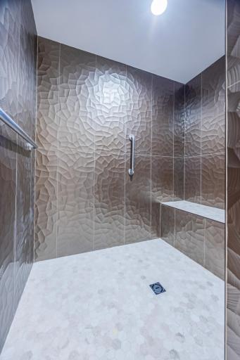 Stunning Walk-In Shower with bench and grab bars!