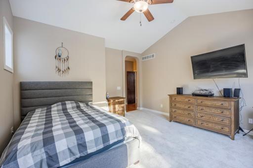 Main floor primary bedroom with vaulted ceilings!