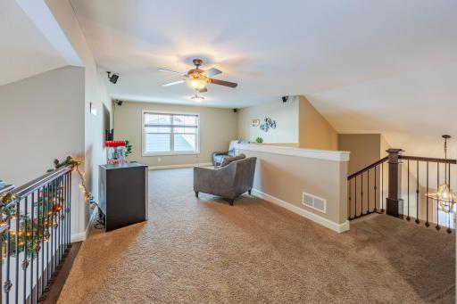 Head to the upper level to view the family room and loft!