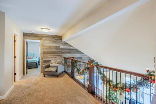 Loft overlooking living room with custom barn wood wall!