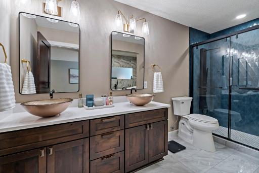 Lower Level primary en-suite bathroom with walk-in shower and soaking tub!