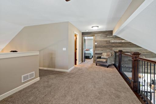 Reclaimed barnwood wall overlooks the living room below!