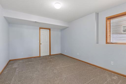 Bedroom number three featuring brand, new carpet and a large walk-in closet