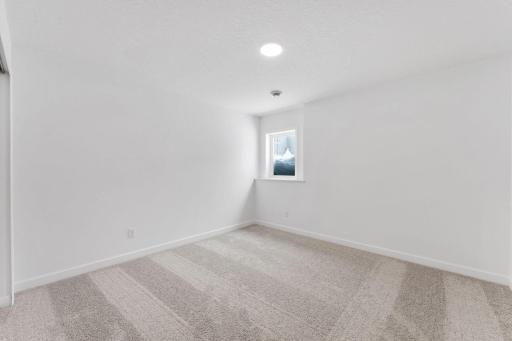This fourth bedroom is perfect for hosting visiting relatives or family members that crave privacy