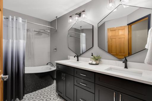 Upper level full bath - fully remodeled and custom designed with soaking tub\shower combo & solar tube.