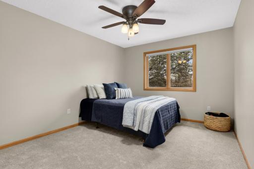 South facing bedroom with queen bed and plenty of room for additional furniture.