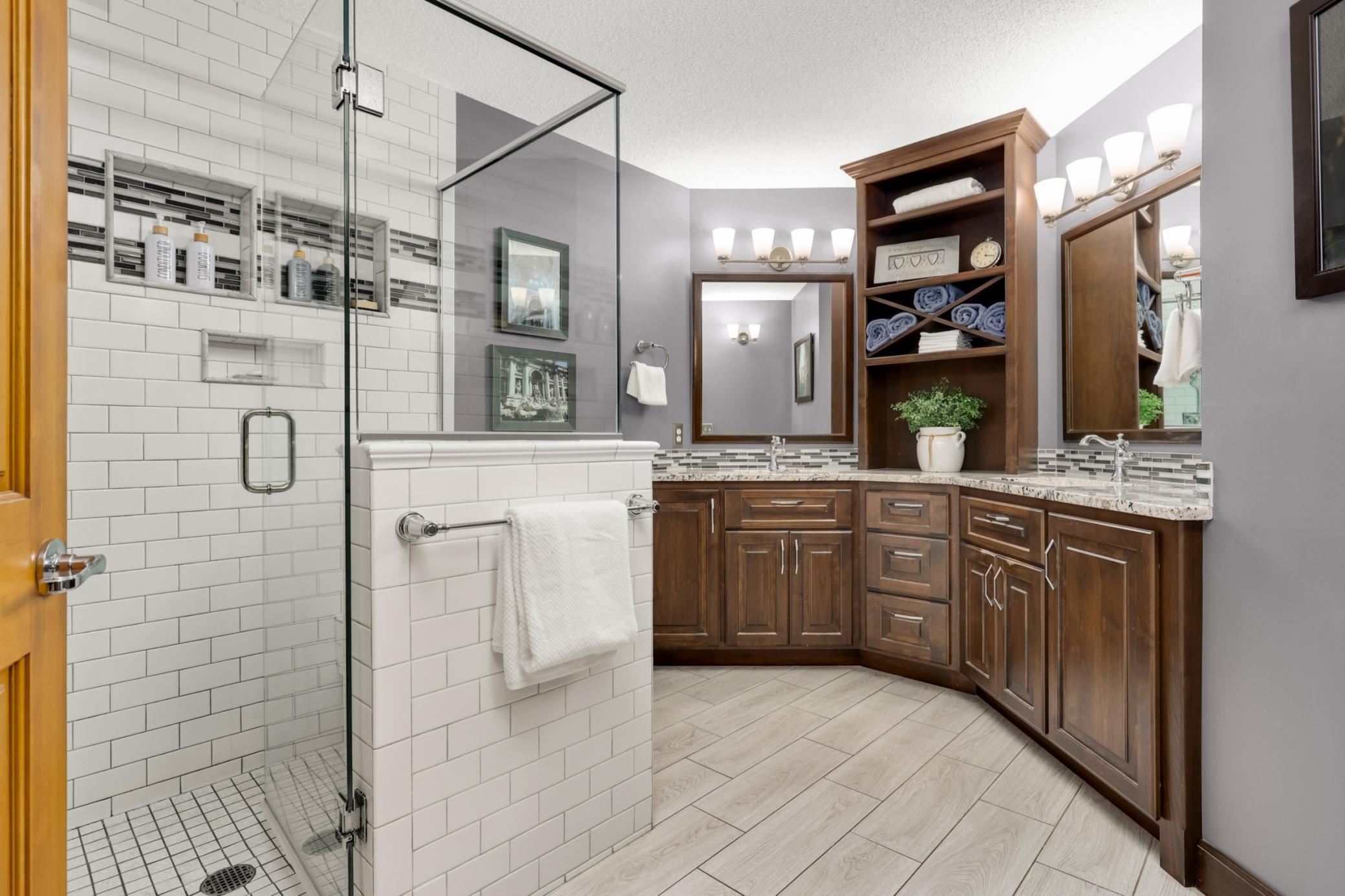 Primary Bathroom Custom Remodeled with subway tiles, shower niches, Kohler fixtures and rain shower.