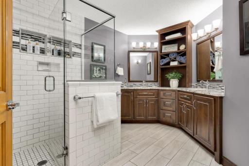 Primary Bathroom Custom Remodeled with subway tiles, shower niches, Kohler fixtures and rain shower.