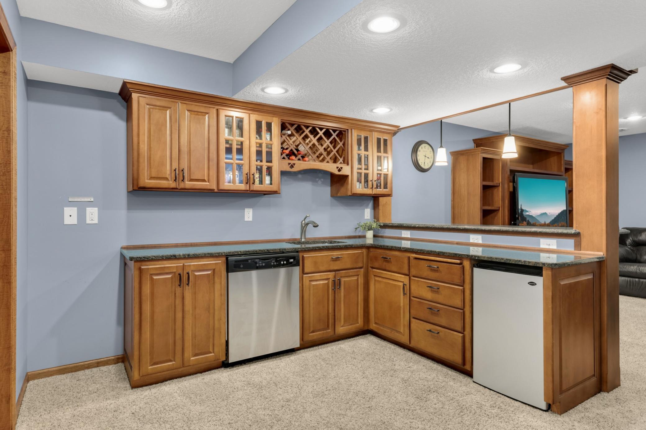Custom built bar with dishwasher, multiple outlets and plenty of storage. Designed for entertaining.