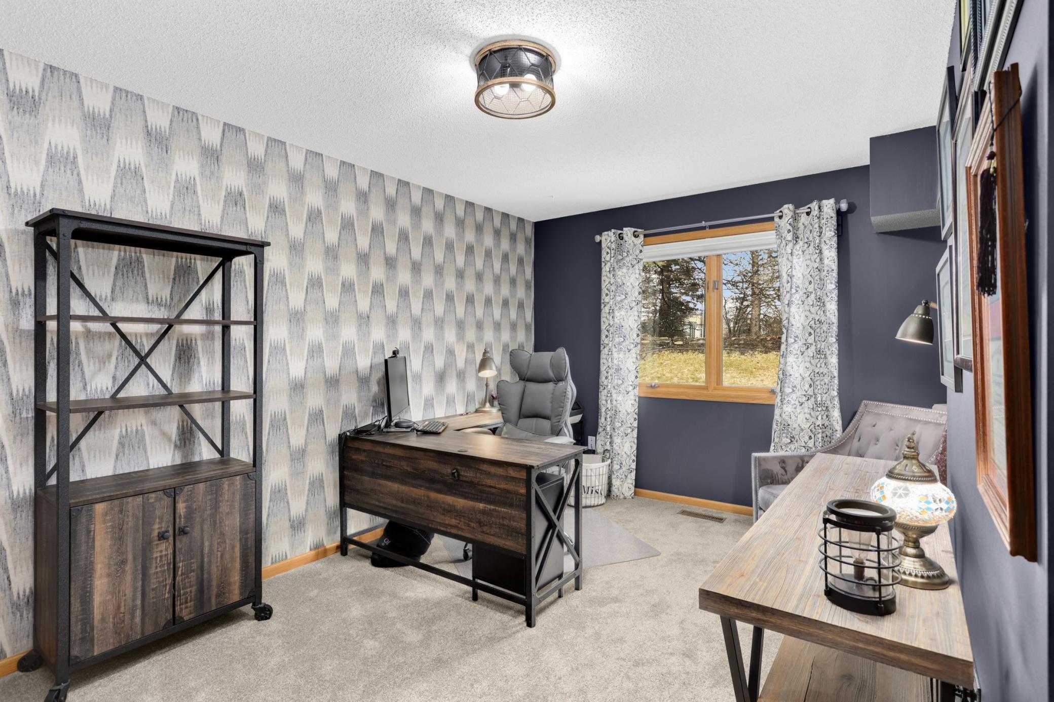 Main floor bedroom currently designed as an office includes closet and window that looks out to the backyard and is adjacent to the 3/4 bath on the main.