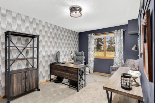 Main floor bedroom currently designed as an office includes closet and window that looks out to the backyard and is adjacent to the 3/4 bath on the main.