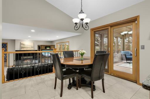 Vaulted eat-in kitchen anchors the connection to the family room and porch as well as a direct line of sight to the open foyer.