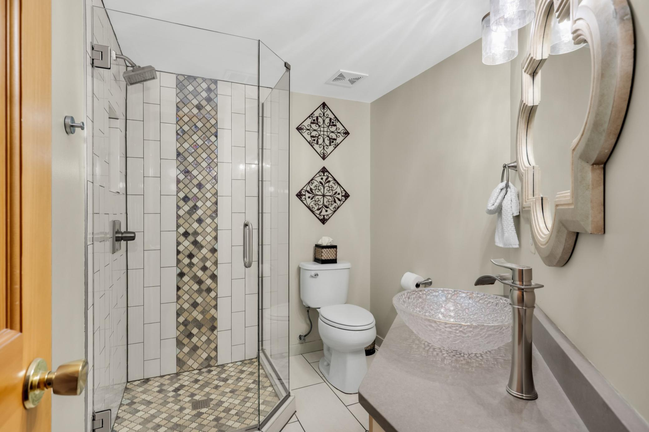 Main floor 3/4 bath remodeled with custom tile work.