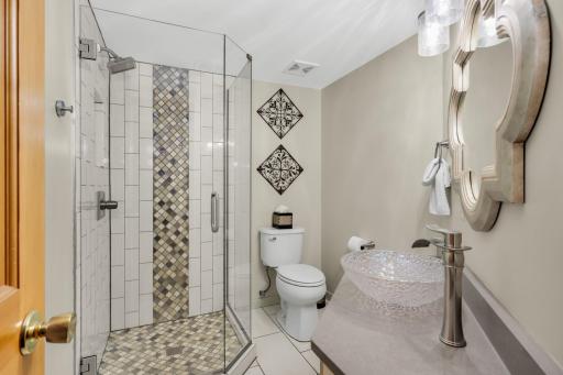 Main floor 3/4 bath remodeled with custom tile work.