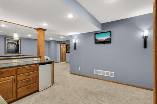 Lower Level Bar area allows for second tv to keep an eye on additional games while entertaining.