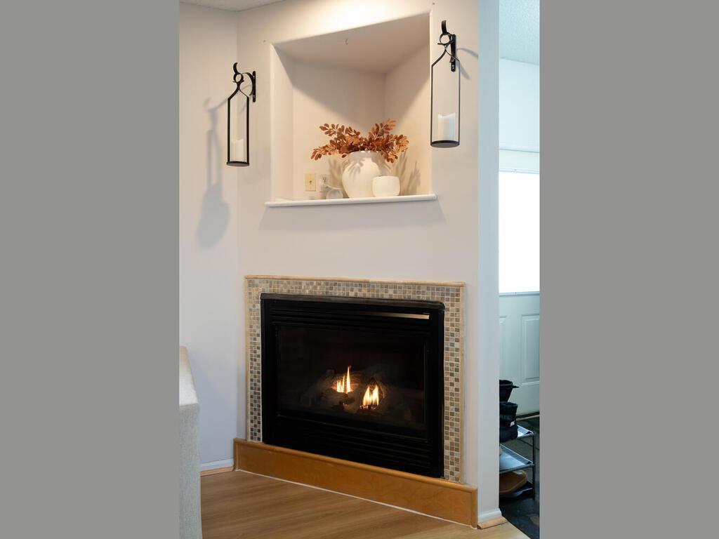 The corner fireplace and built in alcove above adds the coziness that makes this house feel like a home.