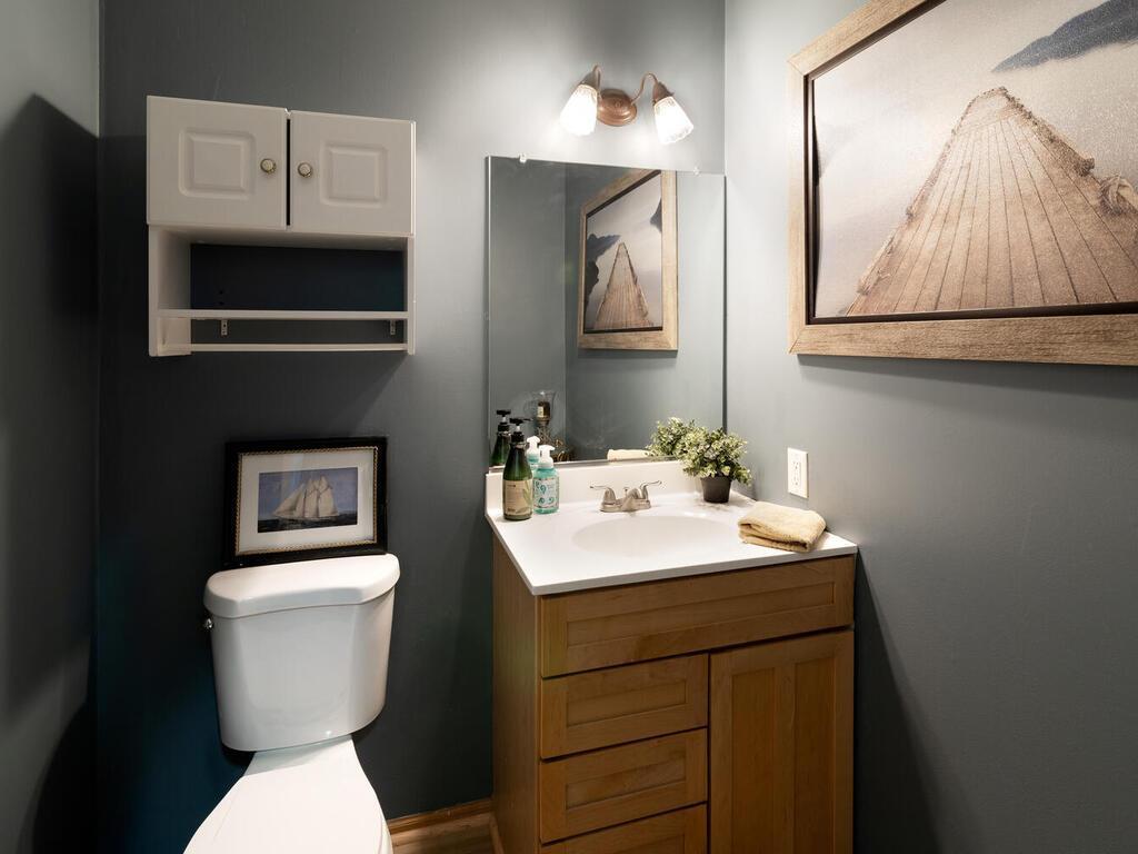 Off of the family room is the main floor half bath.