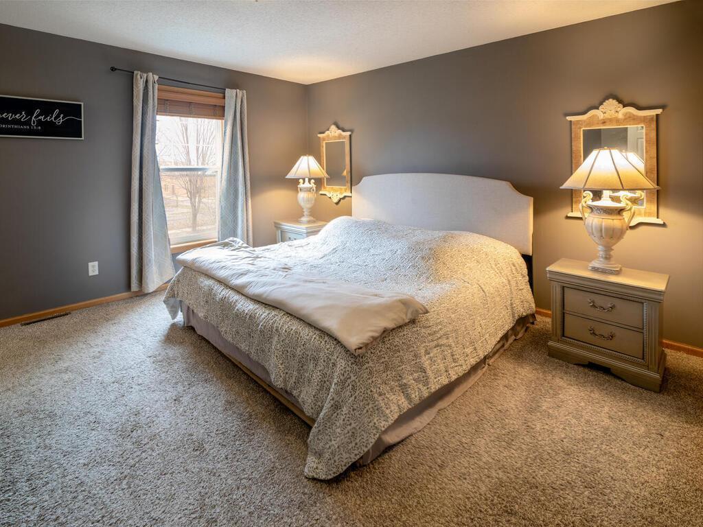 Primary bedroom suite features 3 windows filling the room with lots of natural light.