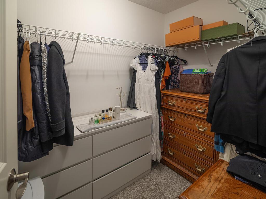 Spacious primary walk-in closet