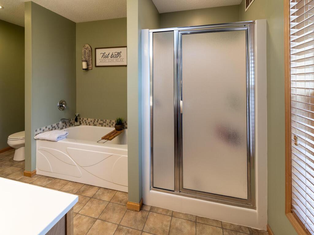 Relax after a long day in the ensuite tub.