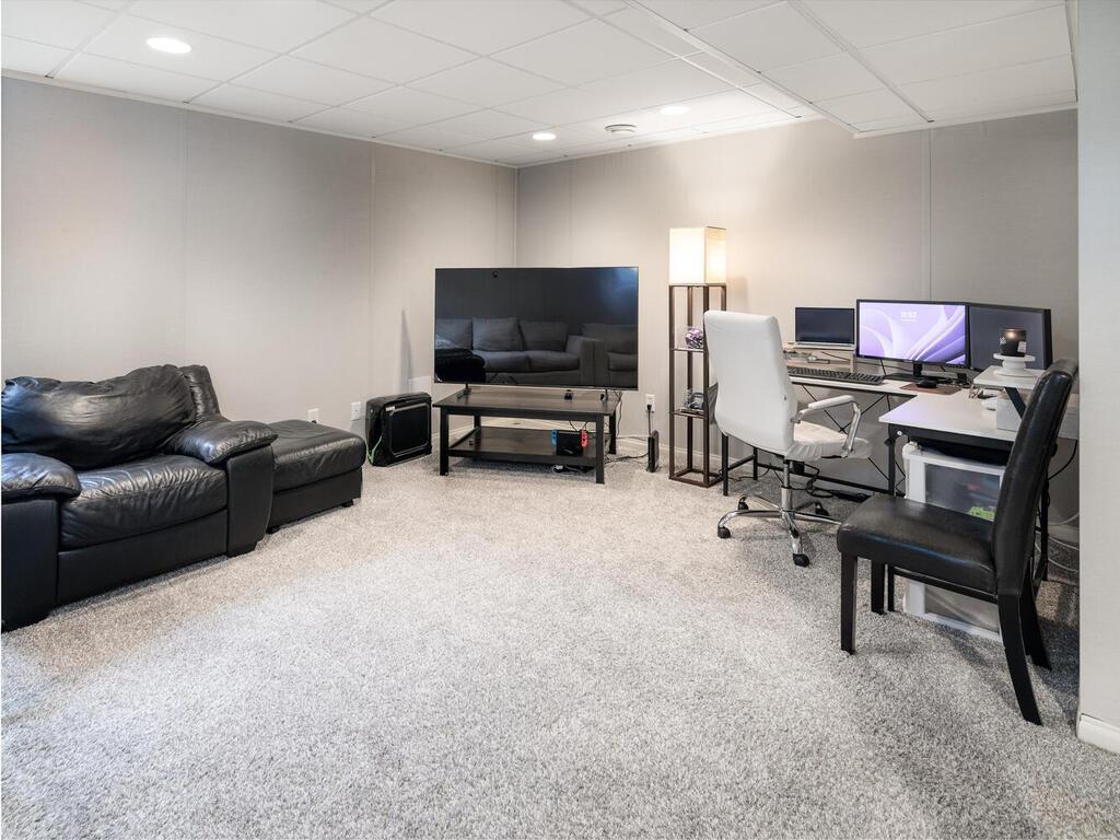 The basement features fabric-wrapped acoustic panels that makes this space perfect for movies, home office, etc.