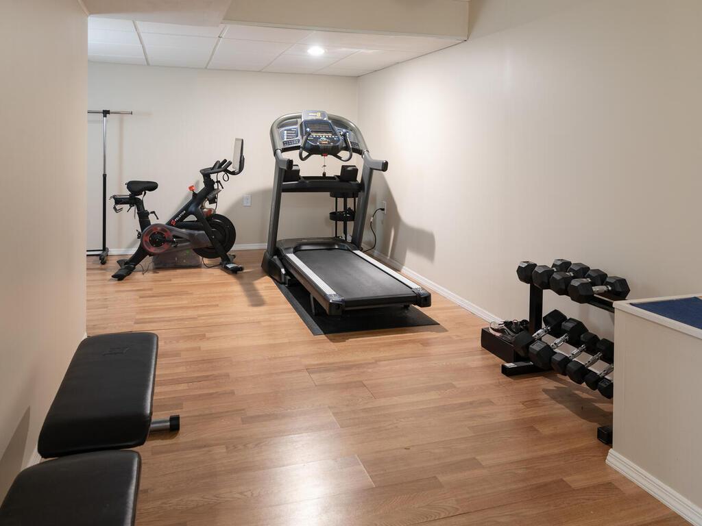 This basement flex space has been used as a home gym but can be utilized in many different ways.