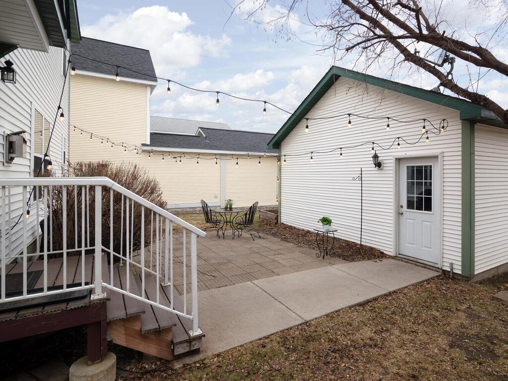 A spacious patio connects the house to the detached 2-car garage.