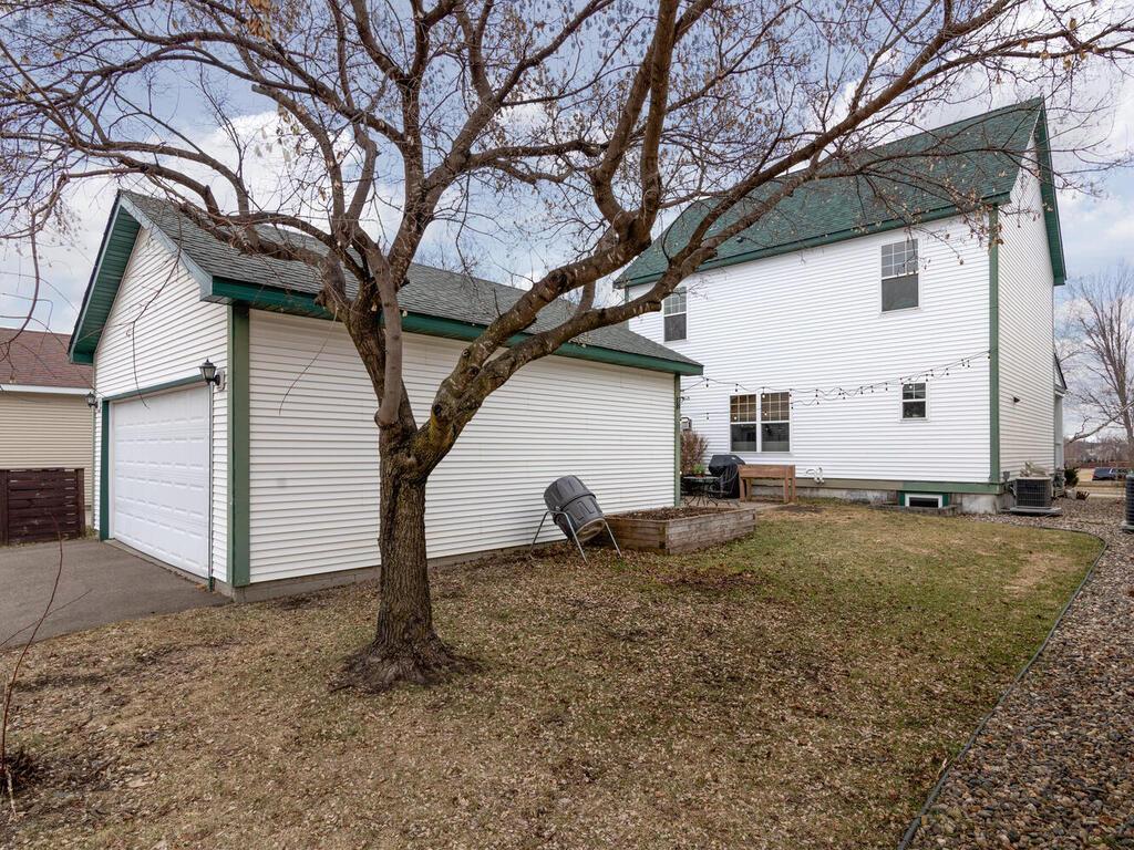 The flat side yard makes a great spot for a playground, garden beds, or playing yard games
