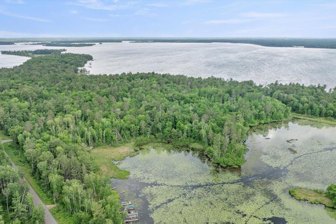 Approximately 920' of shoreline on Mud Lake provides a peaceful natural setting and water access toward the Whitefish Chain.