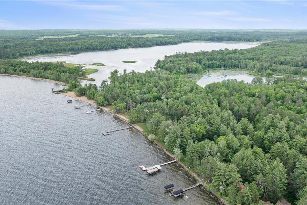 Upper Whitefish, Mud Lake, and Arrowhead Lake come together in this aerial, illustrating the property's unique location within the Whitefish Chain.