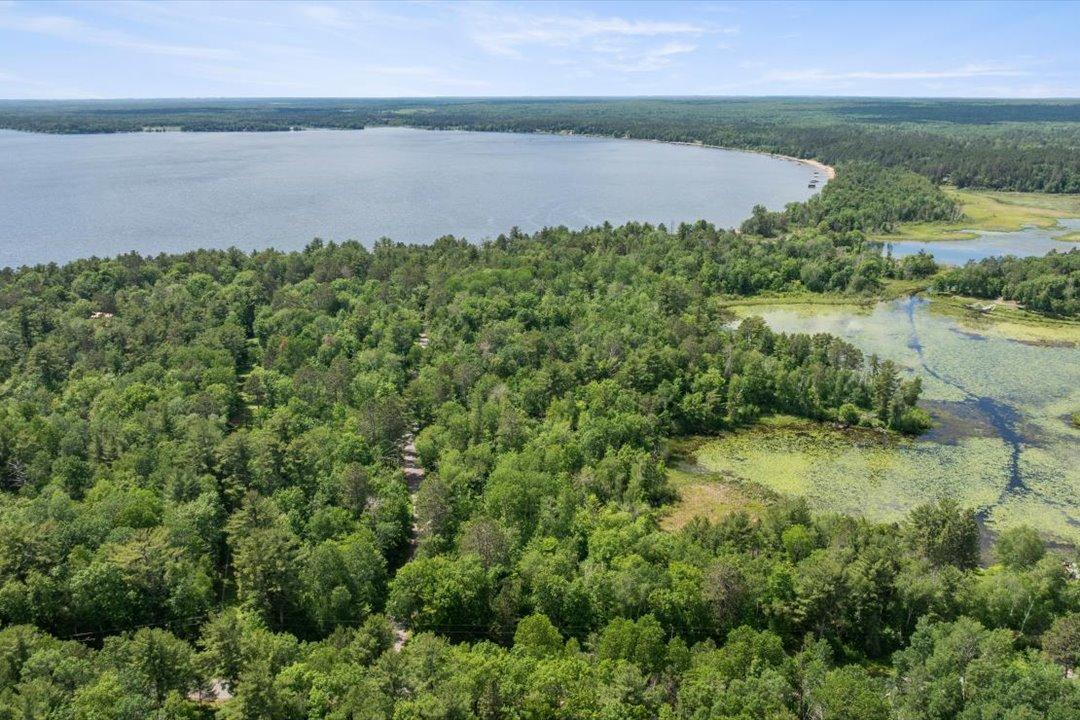 Approximately 6.5 acres lie south of Sunset Shores, with the balance extending north toward approximately 920' of Mud Lake frontage