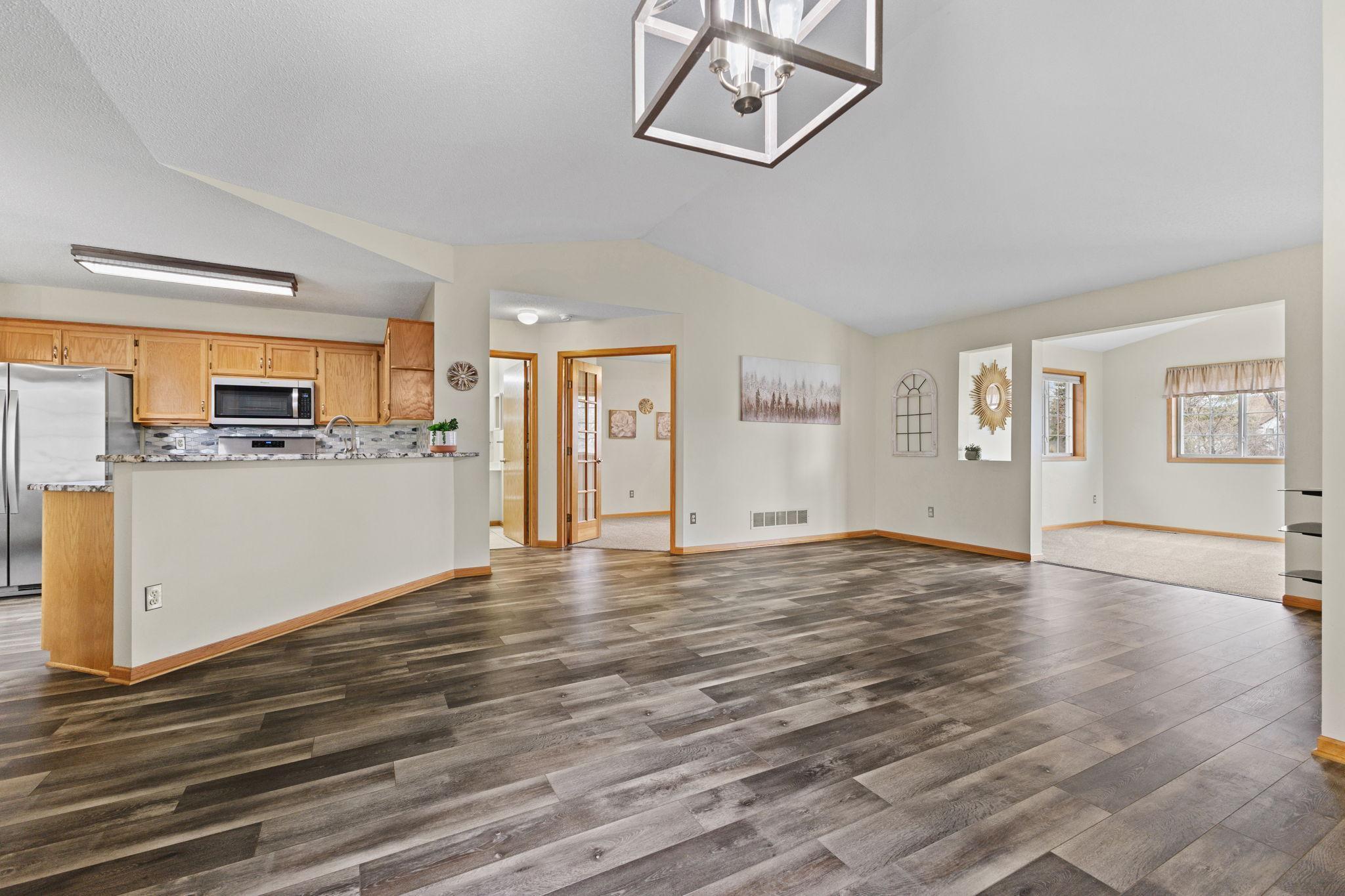 This view if from the casual dining space towards the second bedroom, living room, and sunroom.